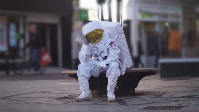  Sad astronaut lost in a city on earth