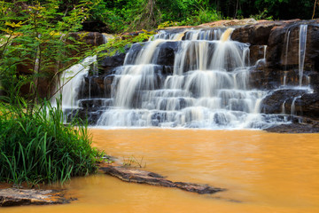 Fototapeta premium Orange waterfall in Thailand