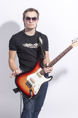 Music Concepts. Portrait of Young Caucasian Guitar Player Posing with Instrument