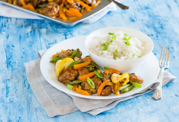 Chicken stir fry with peppers, green beans, lemons
