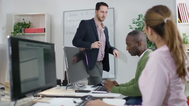  Mature students in adult education class listen to teacher & ask questions