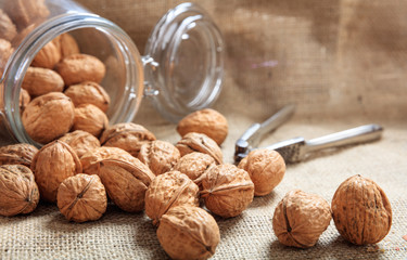 Walnuts and an old nutcracker on a table