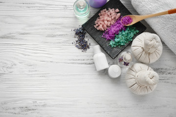 Spa composition with lavender and salt on white wooden background