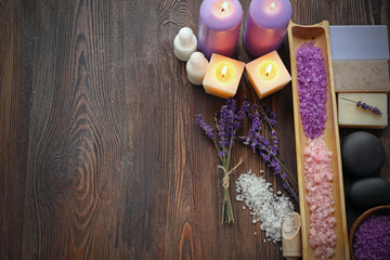 Spa composition with lavender, soap and salt on wooden background