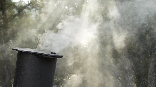 slow motion smoke from a BBQ pit