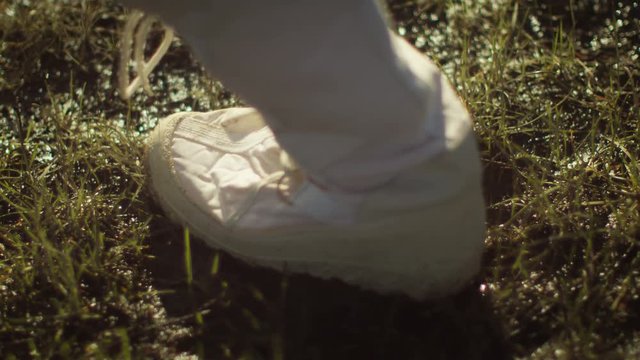  Close up on boot of astronaut treading on muddy terrain