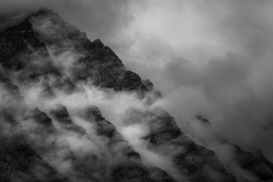 Fototapeta Mountain with rain mist on peak