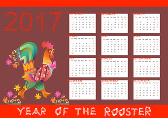 Year of the rooster - calendar with chinese symbol of 2017 year. Week starts on sunday. Vector illustration.