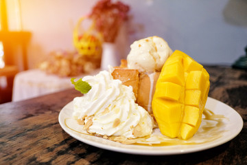 Honey toast with ice cream and sweet sticky rice with coconut milk and fresh mangoes