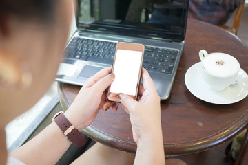 woman using smartphone white screen in coffee shop