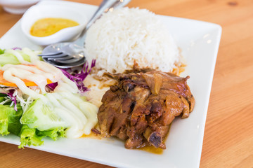 Roasted chicken with rice and vegetable salad.