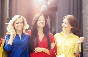 Fototapeta premium Pretty women with shopping bags outdoors