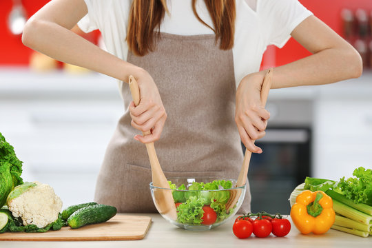 Woman cooking  healthy food in the kitchen