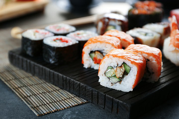 Sushi roll set on wooden board