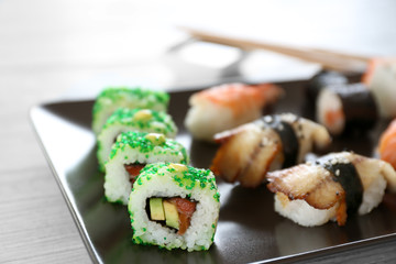 Delicious sushi set on ceramic plate