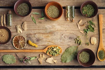 Papier Peint photo Herbes Flat lay of assorted herbs and spices on wooden background