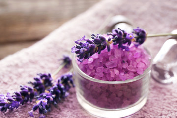 Purple sea salt with lavender on towel