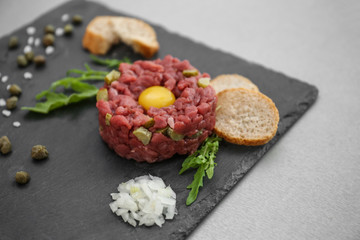 Tasty beef tartare on slateplate