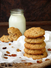 delicious homemade oatmeal cookies with raisins and milk. Selective focus