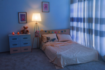 Bed in children room interior