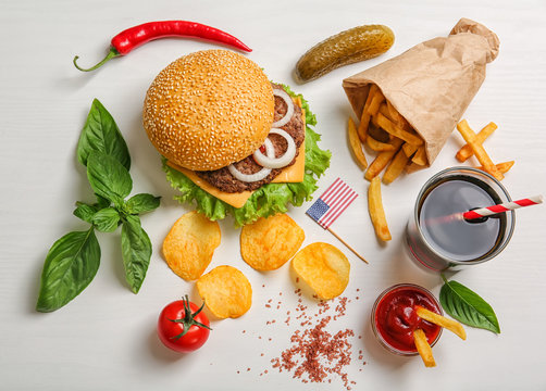 Fresh hamburger with French fries on white background