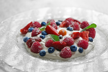 Obraz na płótnie Canvas Berries and cream on plate