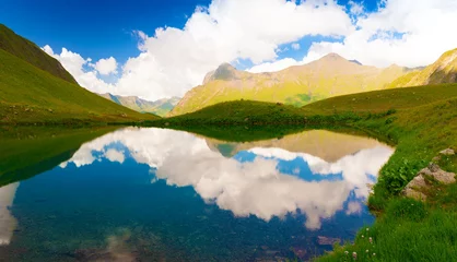 Fototapeten Lake. Mountain summer. Sunny day. Green grass © erainbow
