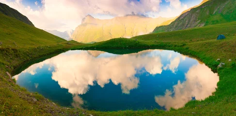 Fototapeten Lake. Mountain summer. Sunset. Green grass, fantastic, reflectio © erainbow