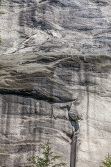 Close up texture of grey stone with cracks