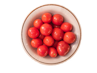 Shiny orange pickled tomatoes isolated