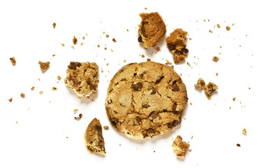 Crunchy chocolate chips cookie with crumbs on white background - obrazy, fototapety, plakaty