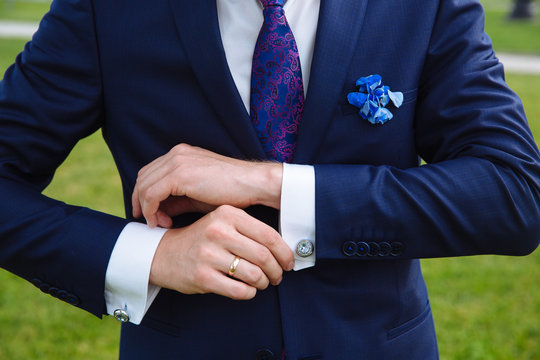 Businessman hands with cufflinks. Elegant gentleman clother
