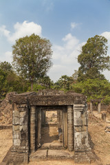 Naklejka premium Gate in a Pre Rup temple, Angkor, Cambodia. Tropical trees in a background