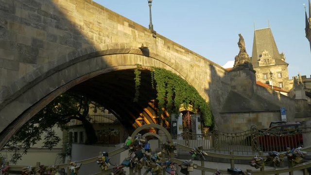 Pan to the west tower of the Charles Bridge in Prague from Certovka or Little Venice