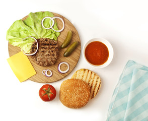 Burger ingredients: beef patty, lettuce, cheese, vegetables