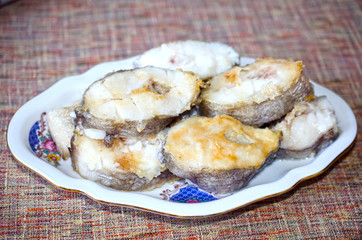 Tasty fried fish on plate