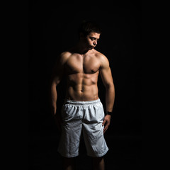 Fototapeta na wymiar young muscle body man in studio
