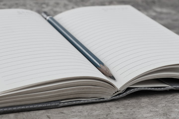 Open notebook on a wooden table