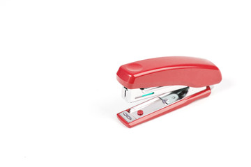 Red stapler isolated on a white background