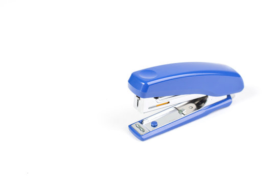 Blue Stapler with staples wires on white background.