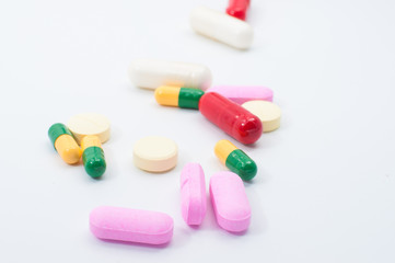 Obraz na płótnie Canvas Pills and capsules on white background