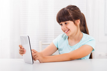 Little girl using digital tablet