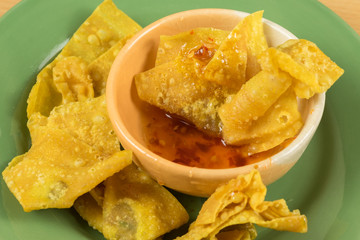 fried dumplings in green dish, Thai food style .(Selective focus)
