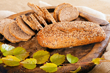 decoration of bread with leaves on a wooden  plank