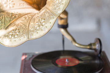old gramophone with vinyl record. selective focus