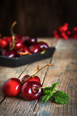 fresh cherries on wooden table