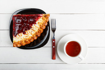Piece of pie with cottage cheese and cherry jam