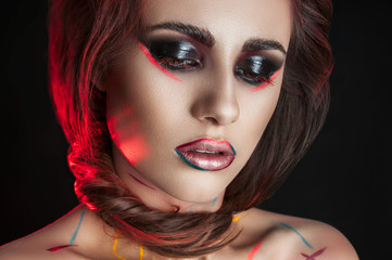 Fototapeta premium Fantasy woman portrait. Beautiful fashionable model with red hair and brown eyes closeup. Creative make up.