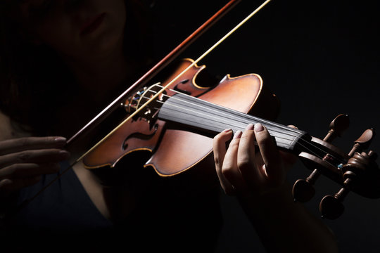 Violinist holding in your hands the violin.