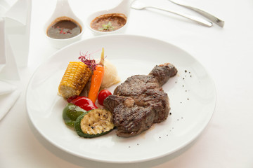  cooked rare sirloin steak  on a white plate
